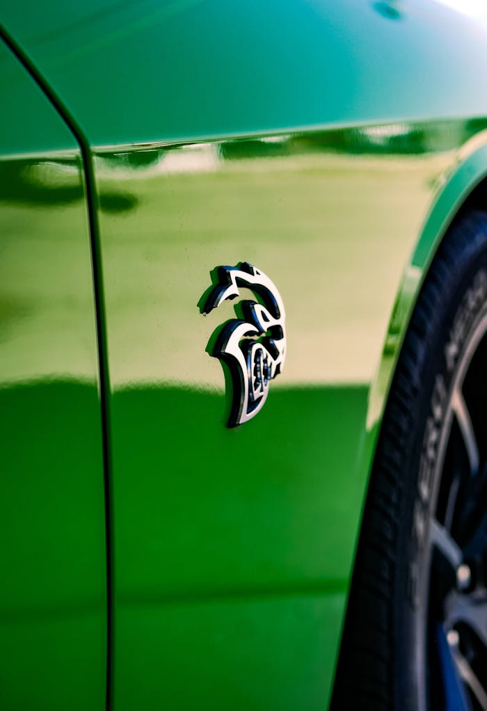 Metal Emblem on a Fender of Green Dodge Challenger SRT Hellcat